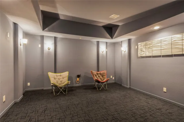 a view of a room with chairs and entryway