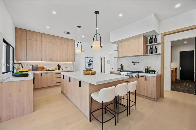 a living room with furniture window and a flat screen tv