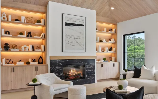 a kitchen with kitchen island granite countertop lots of counter top space and stainless steel appliances