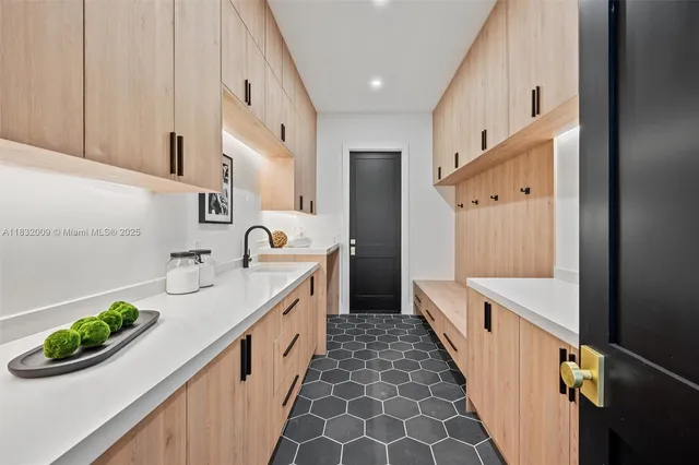 a bathroom with a glass shower door