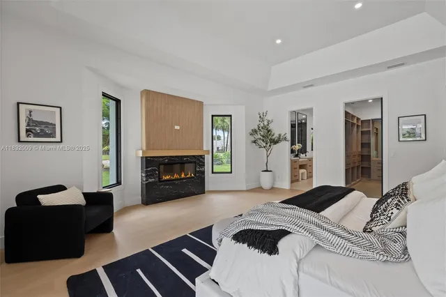 a bathroom with a double vanity sink a toilet and shower