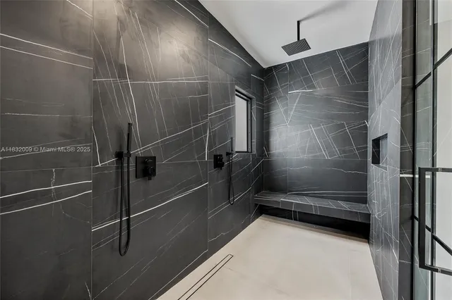 a bathroom with a granite countertop toilet a sink and mirror