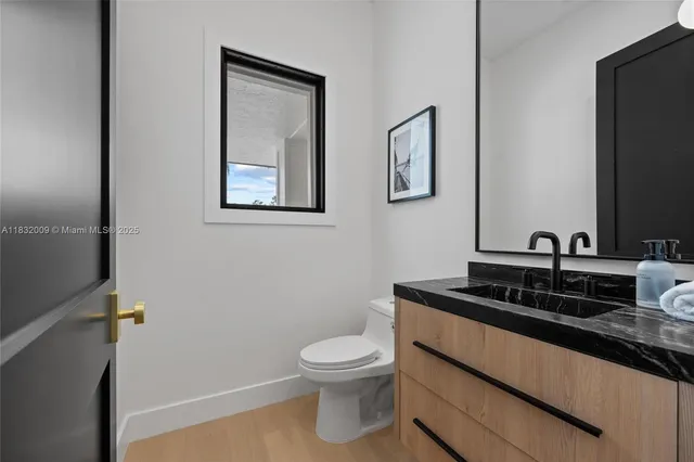 a room with a bed and a potted plant