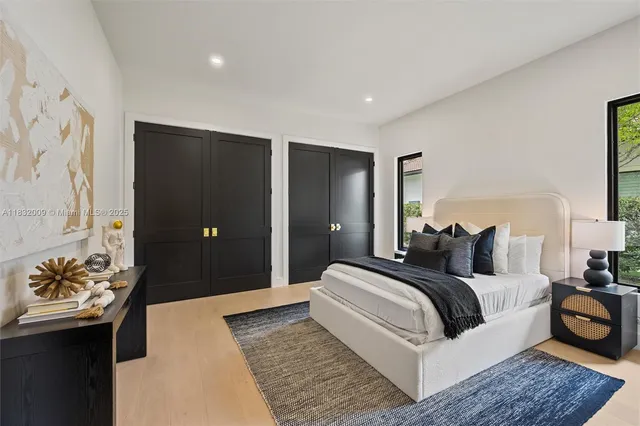 a bedroom with furniture and a potted plant