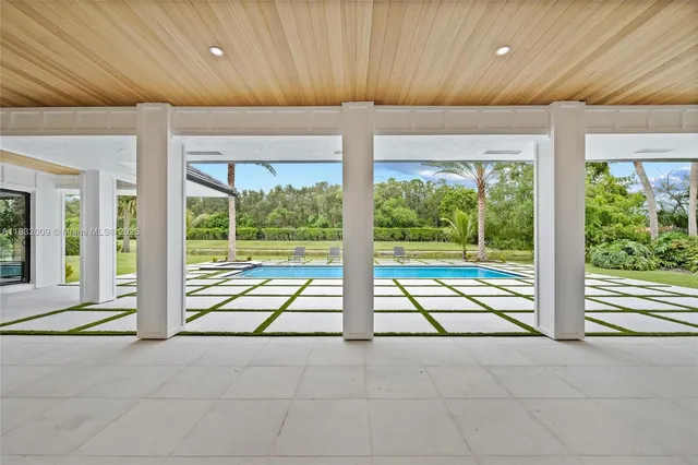 a view of a patio with swimming pool