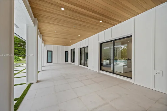 a swimming pool with outdoor seating and yard