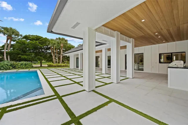 a front view of a house with a yard table and chairs