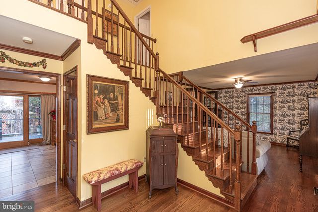 a living room with furniture a fireplace and a large window