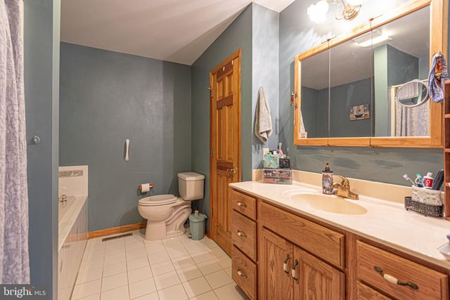 a bathroom with a shower and a sink