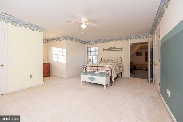 a view of a hallway with a chandelier