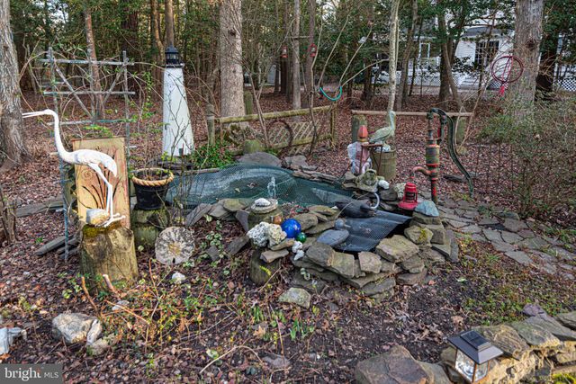 a view of a lake with boats and trees in the background