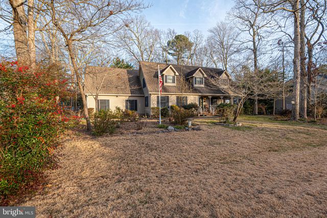 a view of a balcony with wooden floor and bench