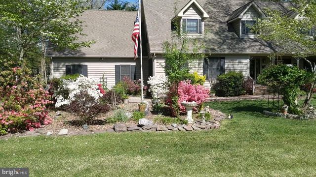 a view of a entryway with wooden floor and door