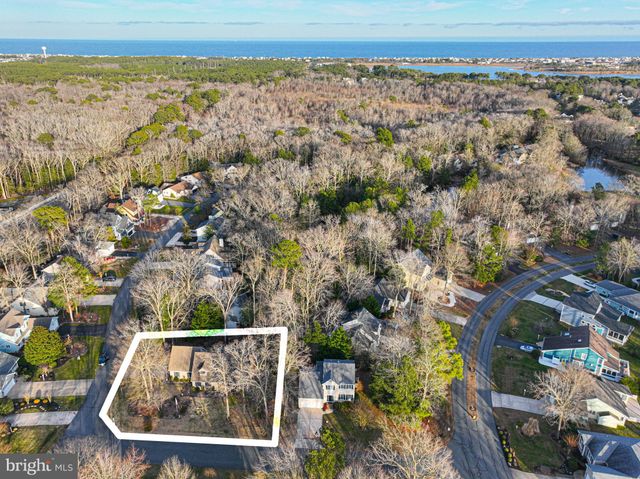 a view of entryway with wooden floor and stairs