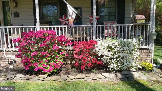 a bed room with a bed and a television