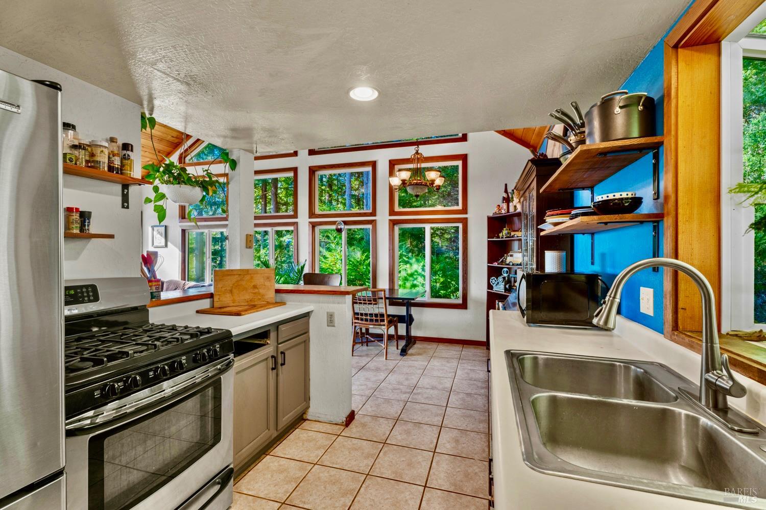 40401 Little River-Airport Road Little River, CA 95456 - Photo 11 of 47 a kitchen with stainless steel appliances granite countertop a stove and a sink