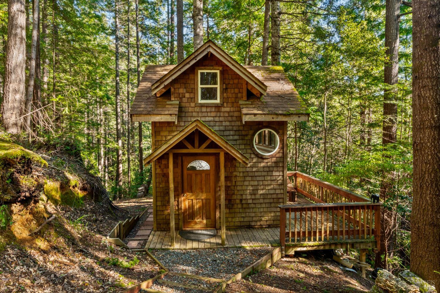 40401 Little River-Airport Road Little River, CA 95456 - Photo 28 of 47 a view of a small house with a tree and wooden fence
