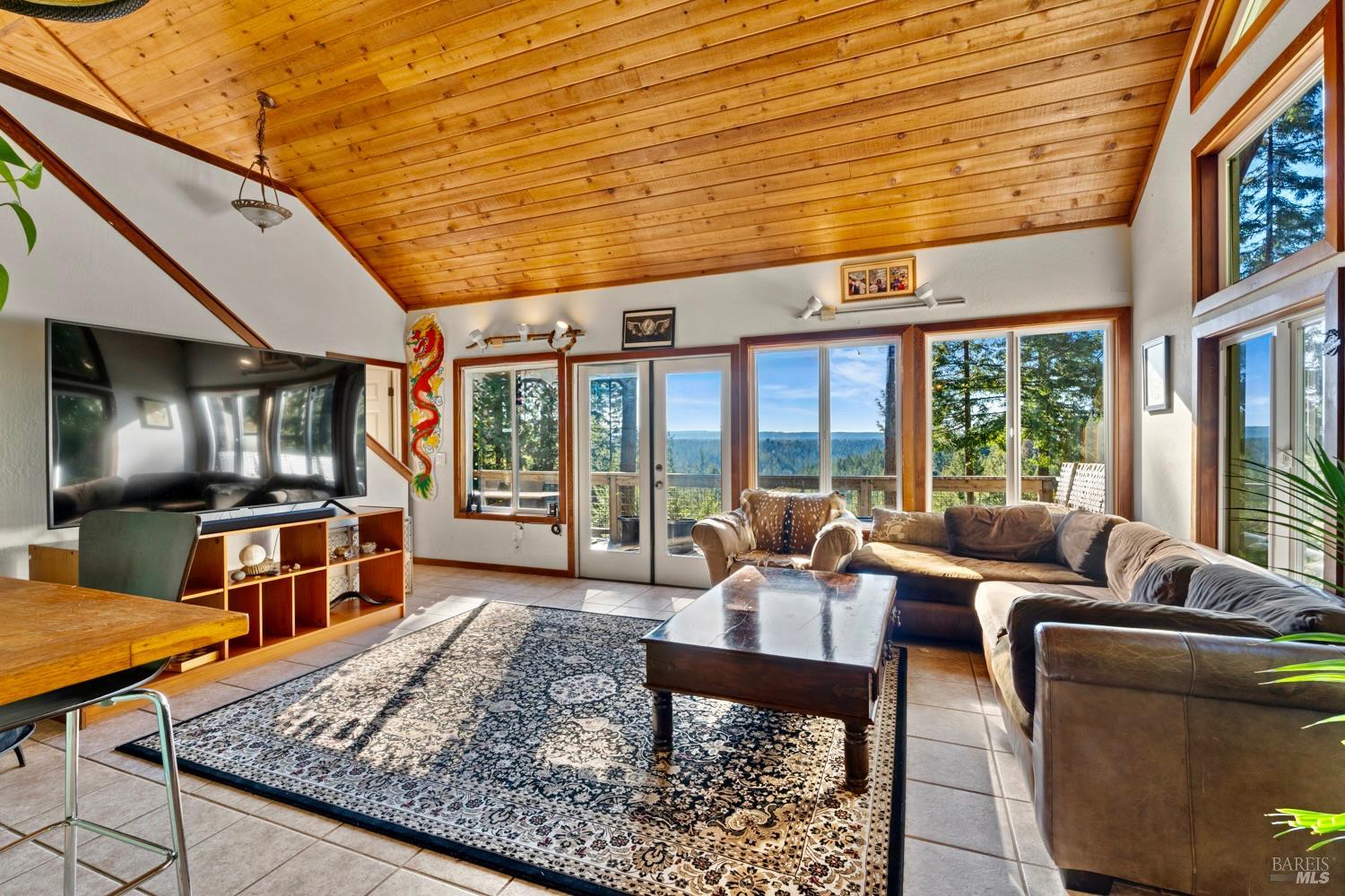 40401 Little River-Airport Road Little River, CA 95456 - Photo 7 of 47 a living room with furniture floor to ceiling window and a flat screen tv