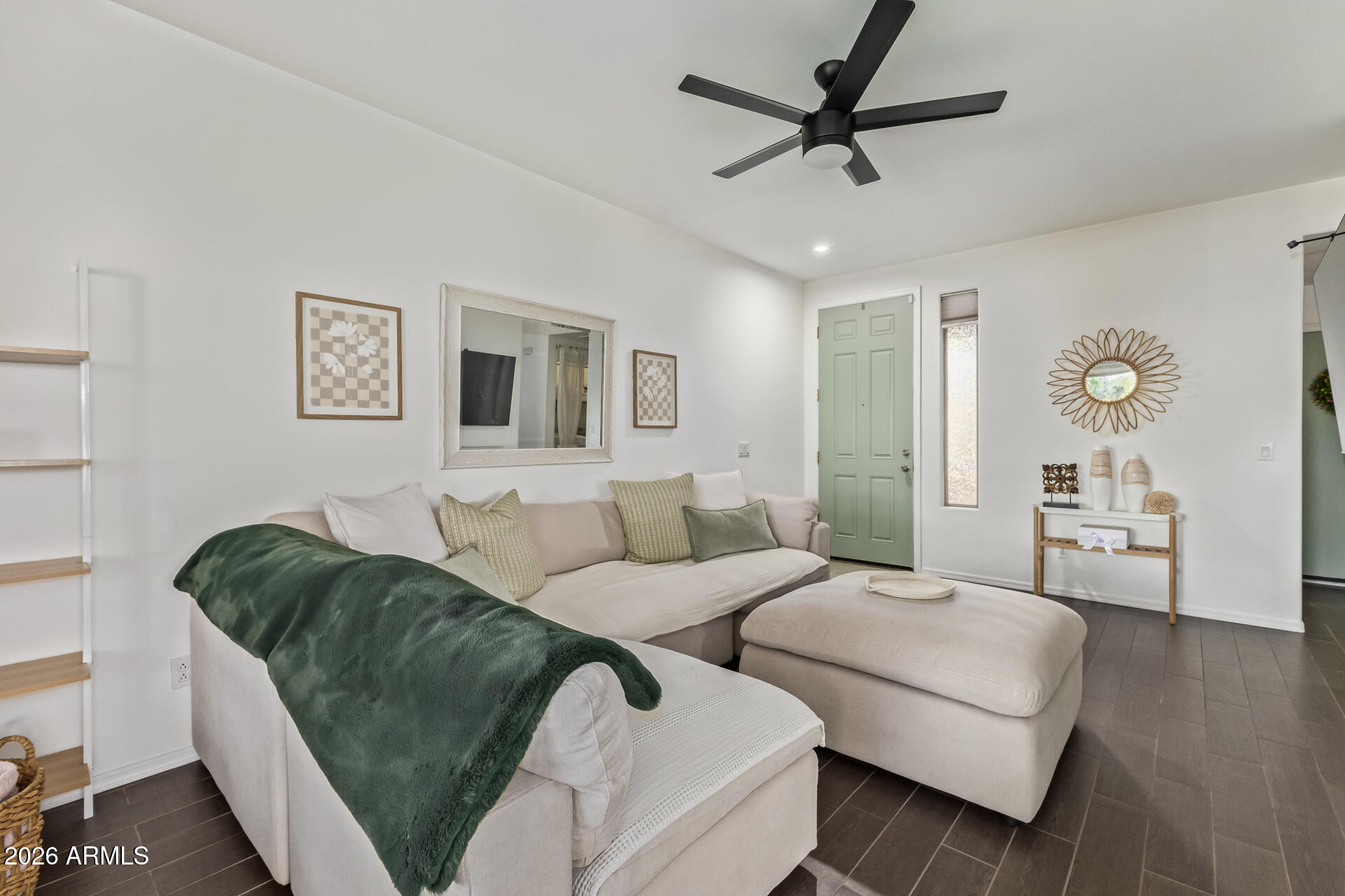 2600 East Springfield Place, Unit 34 Chandler, AZ 85286 - Photo 1 of 38 a living room with furniture and a wooden floor