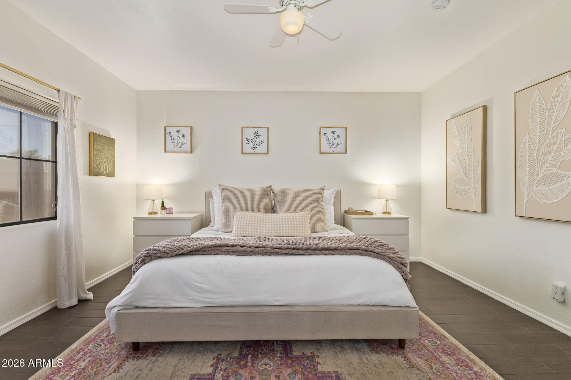 2600 East Springfield Place, Unit 34 Chandler, AZ 85286 - Photo 11 of 38 a spacious bedroom with a bed and painting on the wall