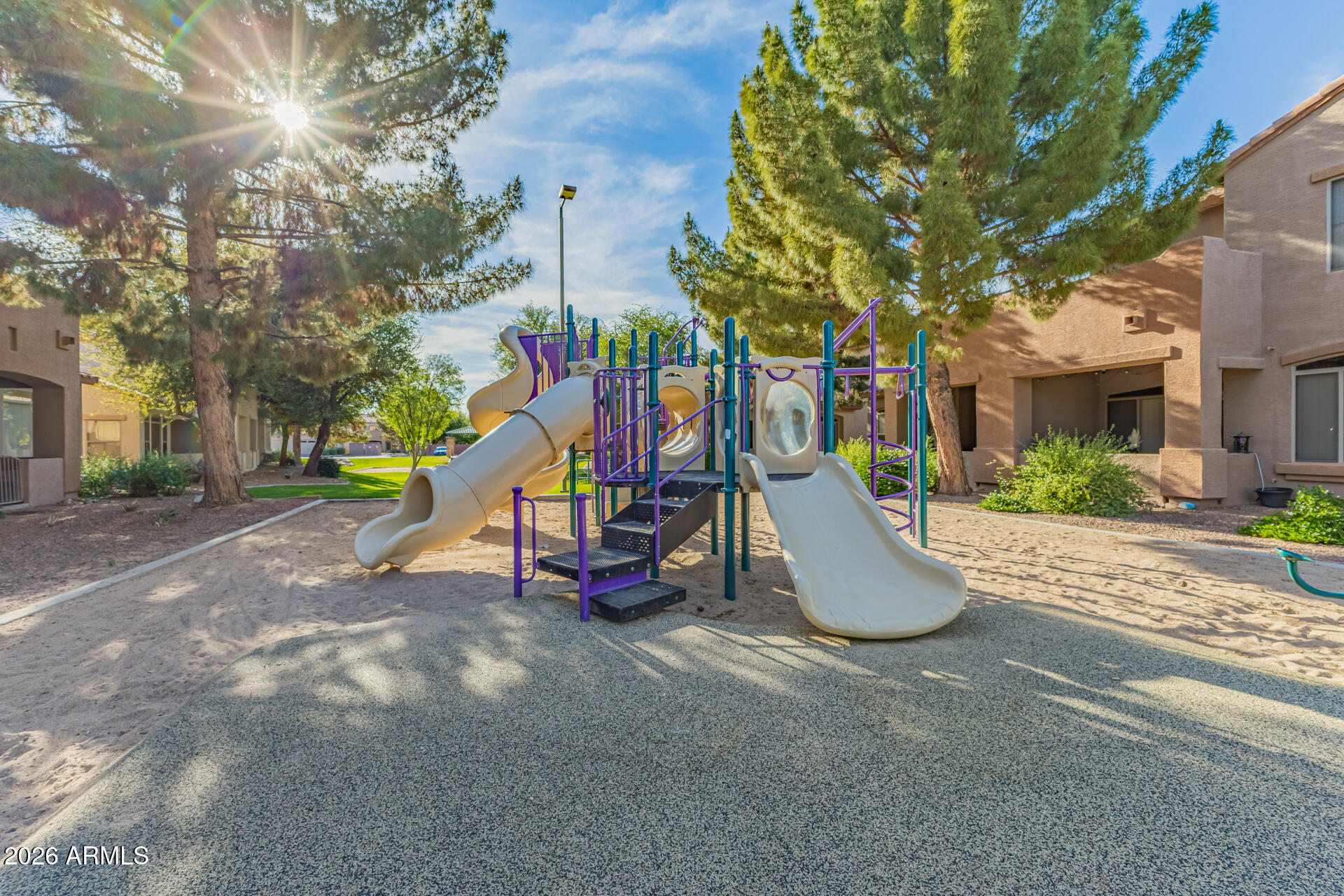 2600 East Springfield Place, Unit 34 Chandler, AZ 85286 - Photo 32 of 38 a view of a park with swings and slides