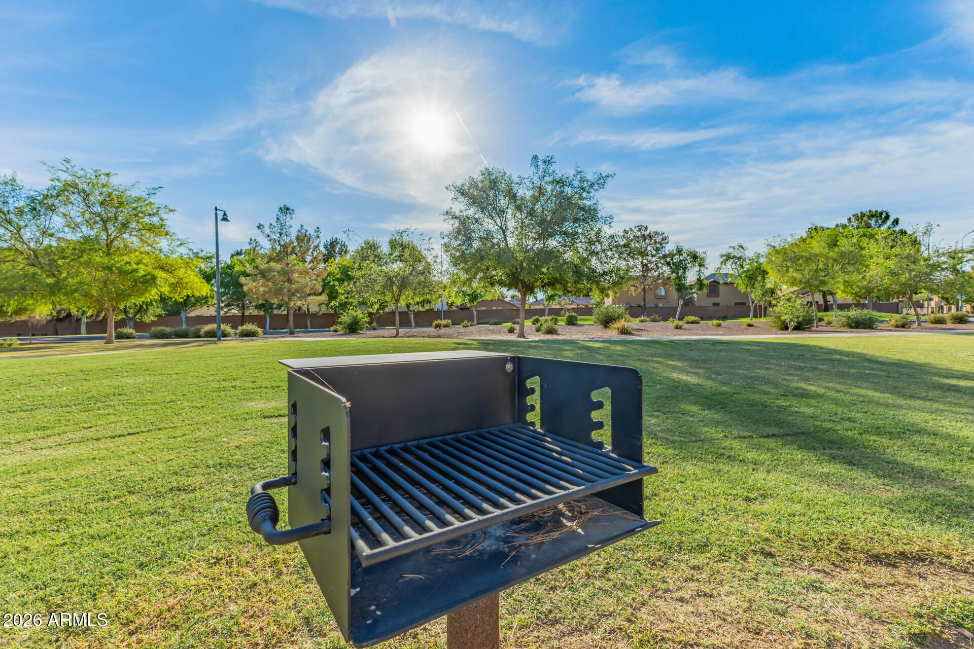 2600 East Springfield Place, Unit 34 Chandler, AZ 85286 - Photo 36 of 38 a view of a bench in the garden near a lake