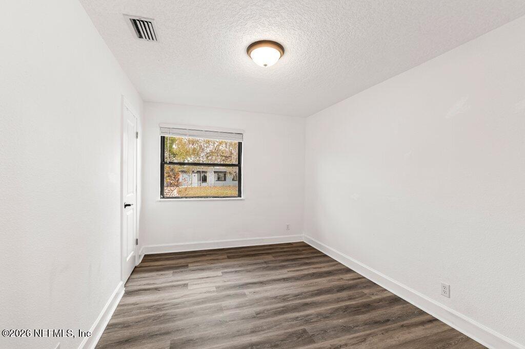 6731 Sans Souci Road Jacksonville, FL 32216 - Photo 17 of 27 a view of a room with wooden floor