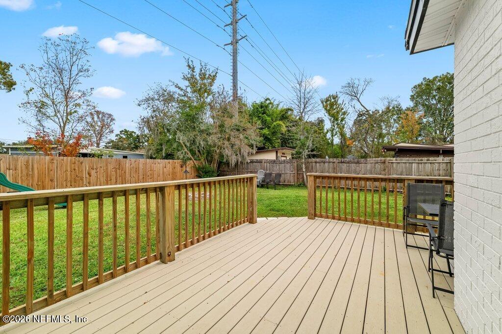 6731 Sans Souci Road Jacksonville, FL 32216 - Photo 22 of 27 a view of a balcony with wooden floor