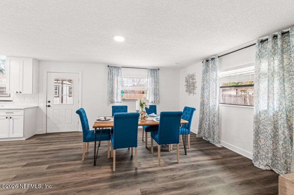 6731 Sans Souci Road Jacksonville, FL 32216 - Photo 5 of 27 a view of a dining room with furniture and wooden floor