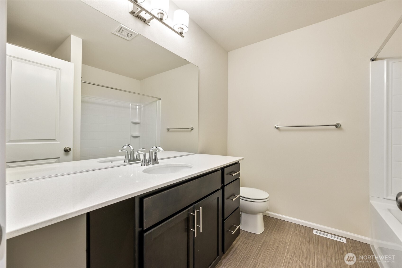 107 Willowbrook Drive Chehalis, WA 98532 - Photo 19 of 30 a bathroom with a sink a toilet a light fixture and a mirror