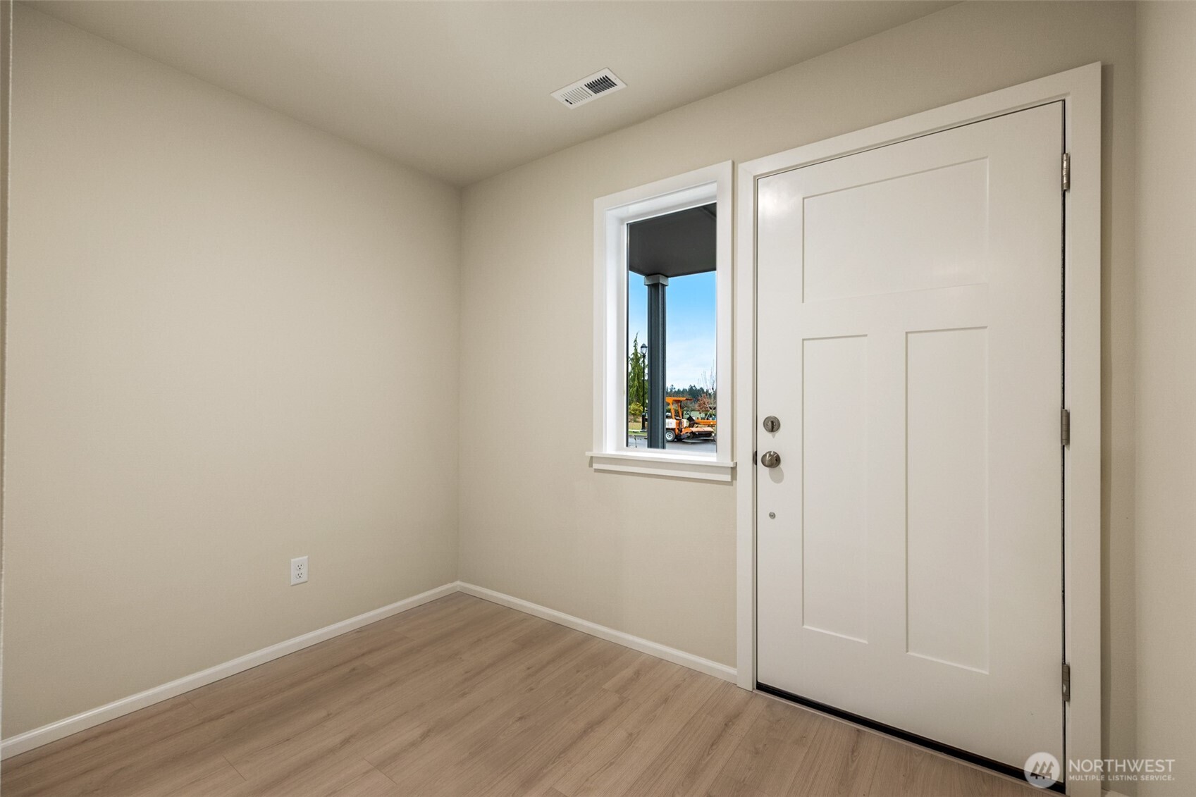 107 Willowbrook Drive Chehalis, WA 98532 - Photo 4 of 30 a view of an empty room with wooden floor and a window