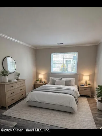 a bedroom with a bed and window with lamp