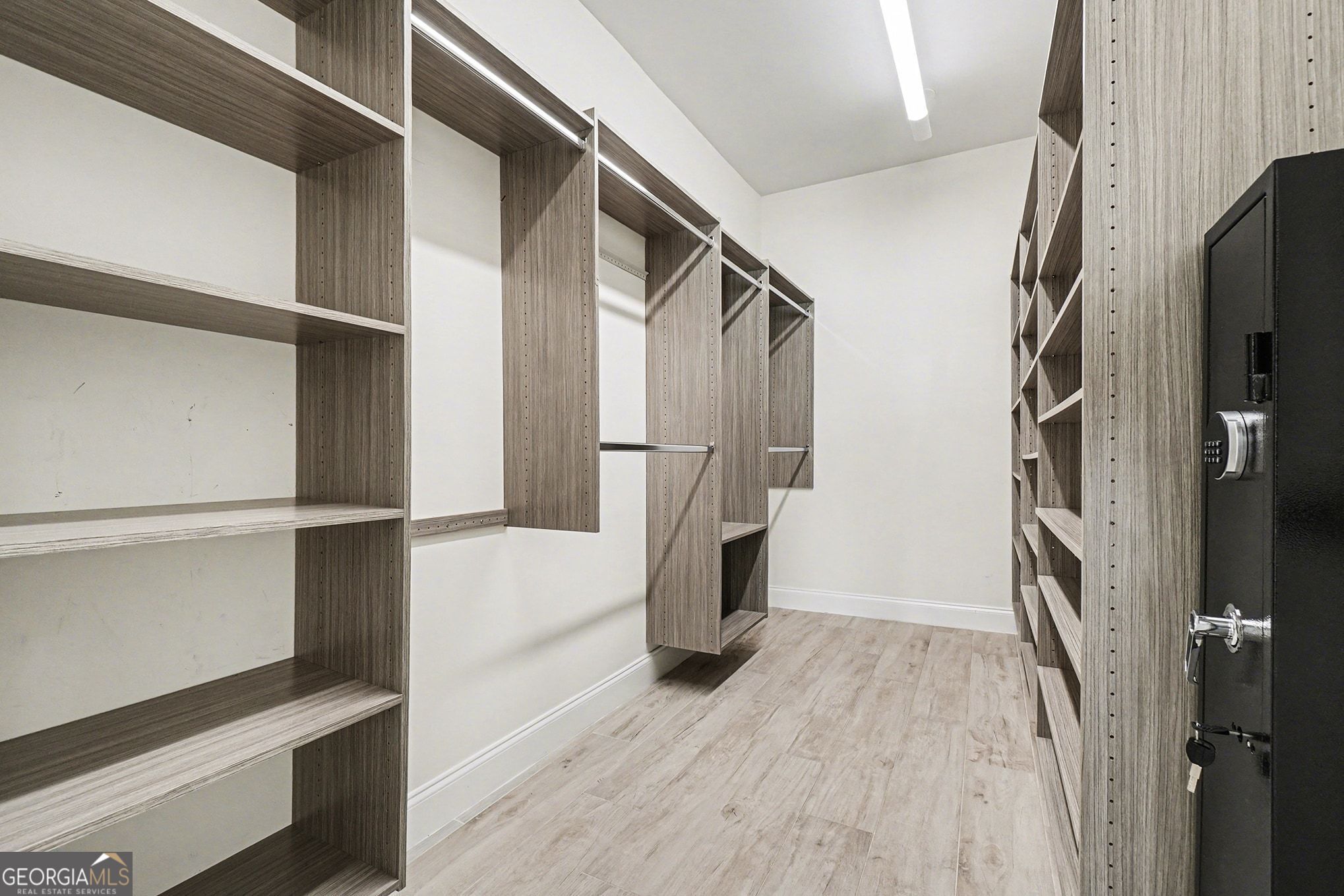 1480 Norris Place Northwest Atlanta, GA 30314 - Photo 11 of 30 a view of walk in closet with wooden floor and fan