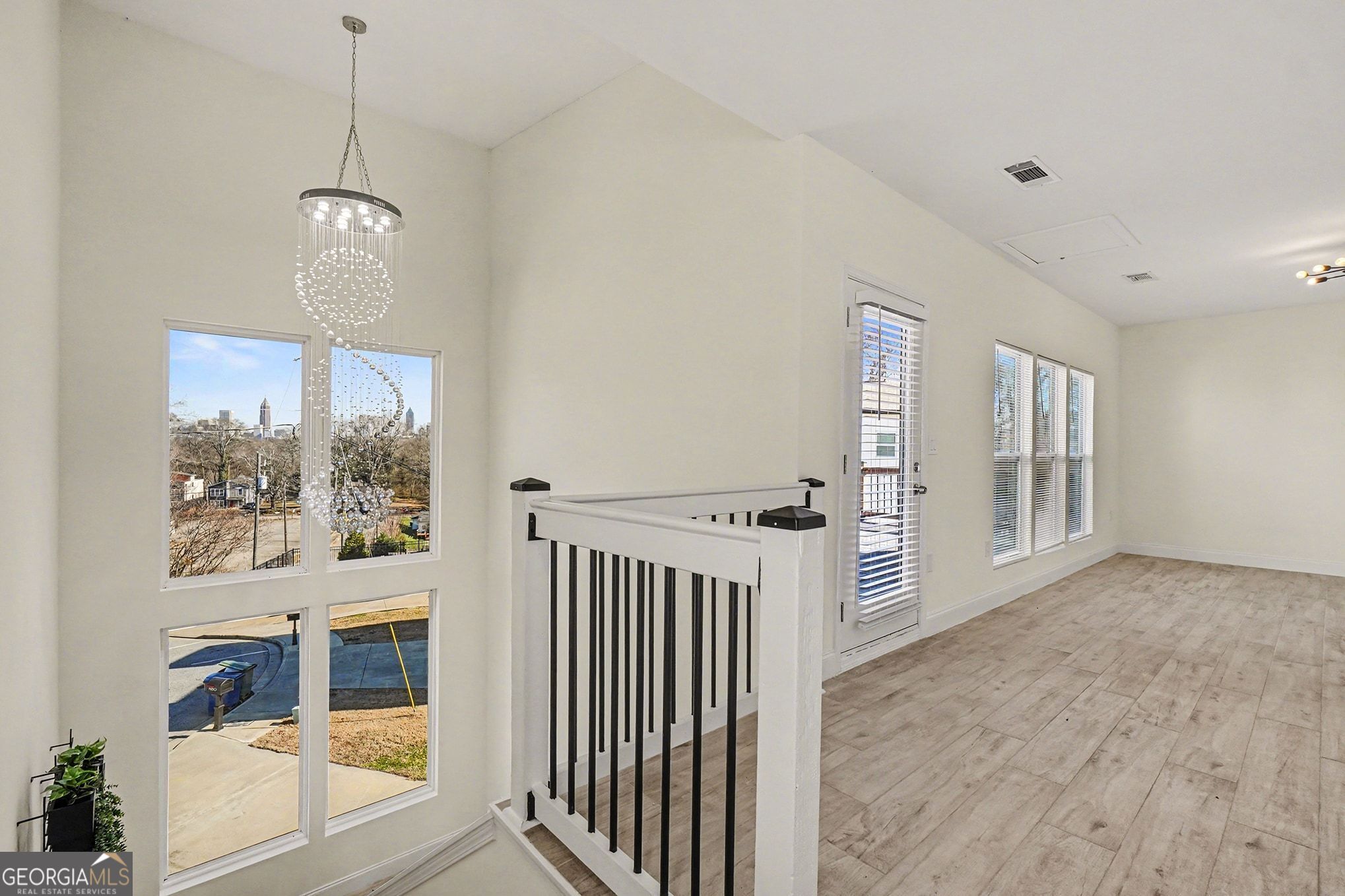 1480 Norris Place Northwest Atlanta, GA 30314 - Photo 18 of 30 a view of a room with wooden floor and windows