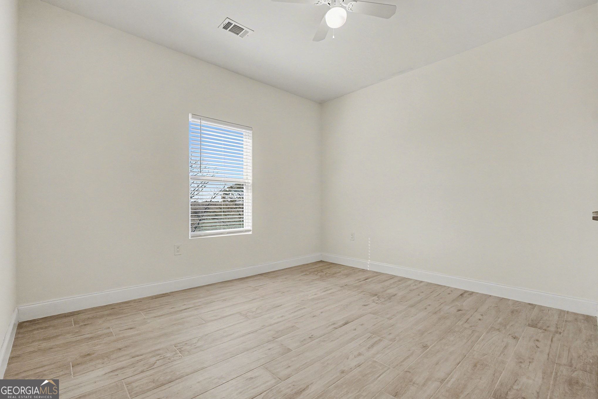 1480 Norris Place Northwest Atlanta, GA 30314 - Photo 22 of 30 an empty room with wooden floor and windows