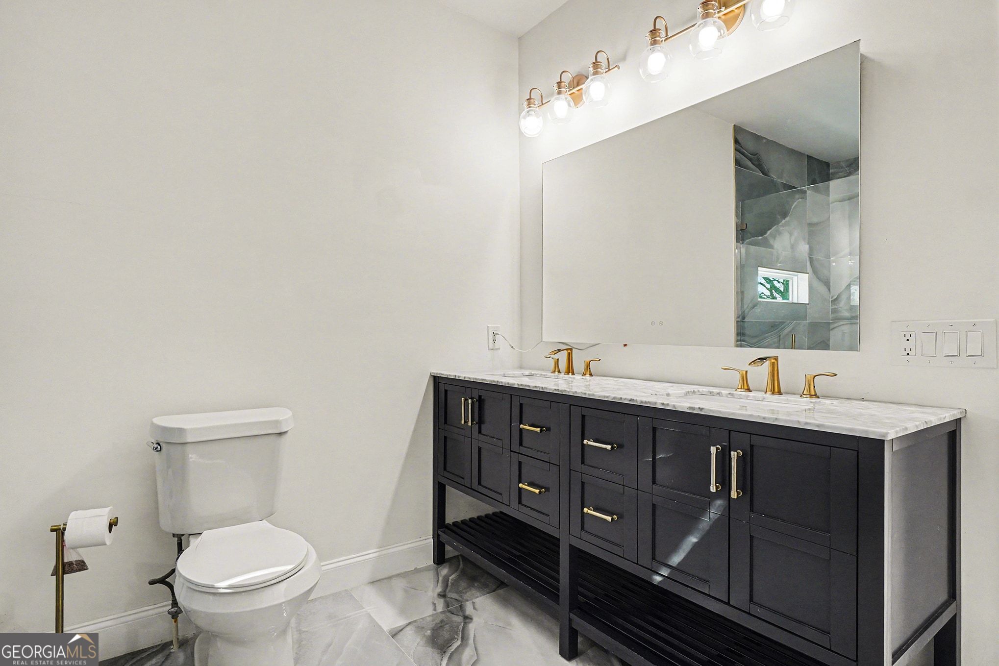 1480 Norris Place Northwest Atlanta, GA 30314 - Photo 6 of 30 a bathroom with a toilet a sink and mirror