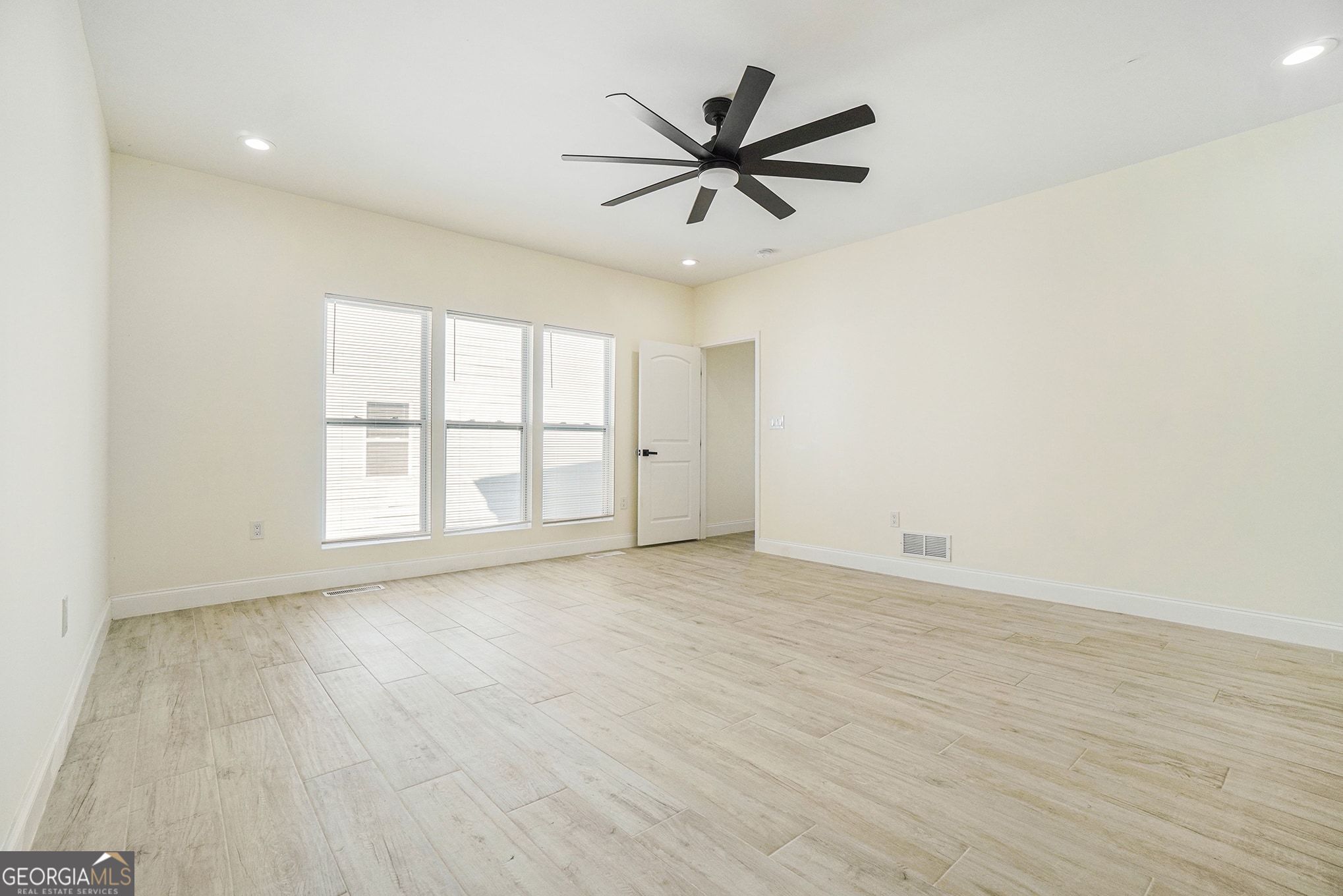 1480 Norris Place Northwest Atlanta, GA 30314 - Photo 7 of 30 wooden floor in an empty room with a window