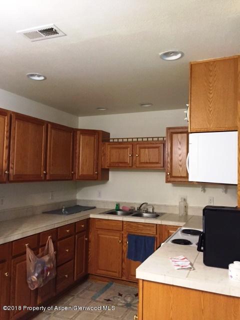 414 East 7th Street Rifle, CO 81650 - Photo 17 of 20 a kitchen with stainless steel appliances granite countertop a sink and a stove