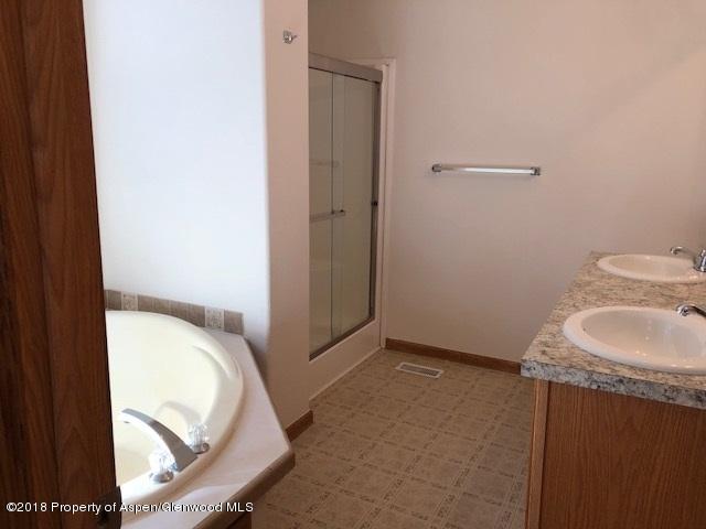 414 East 7th Street Rifle, CO 81650 - Photo 6 of 20 a bathroom with a sink and a mirror