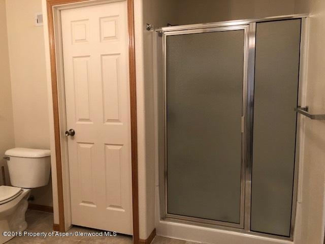 414 East 7th Street Rifle, CO 81650 - Photo 7 of 20 a bathroom with a toilet and a shower