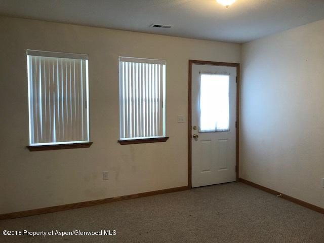 414 East 7th Street Rifle, CO 81650 - Photo 8 of 20 a view of an empty room with a window