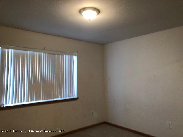 414 East 7th Street Rifle, CO 81650 - Photo 9 of 20 an empty room with a window