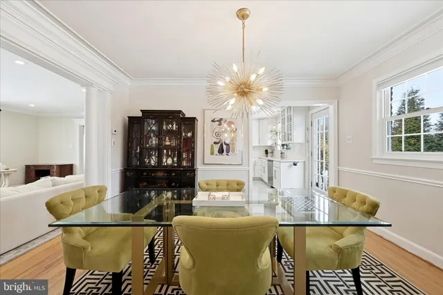 a large kitchen with a table and chairs