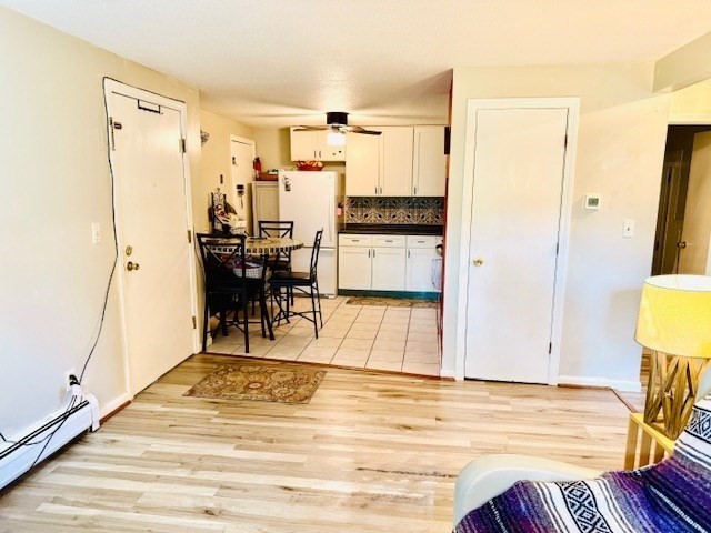 85 Ridgewood Lane, Unit 18 Gardner, MA 01440 - Photo 4 of 13 a view of kitchen and dining room with wooden floor