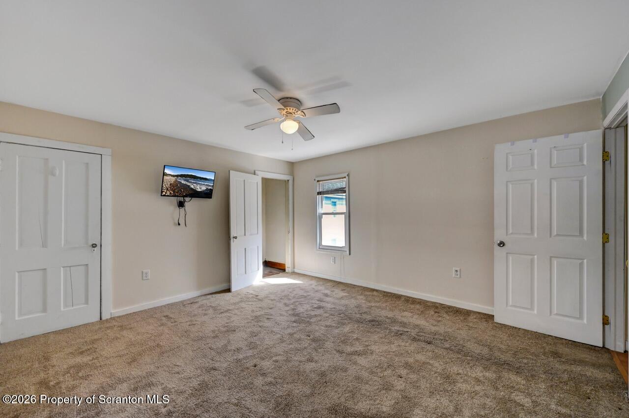 328 Ferdinand Street Scranton, PA 18508 - Photo 34 of 40 a view of an empty room with a ceiling fan