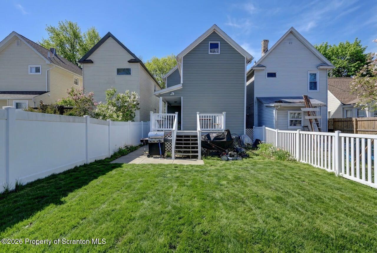 328 Ferdinand Street Scranton, PA 18508 - Photo 40 of 40 a view of backyard with garden and deck