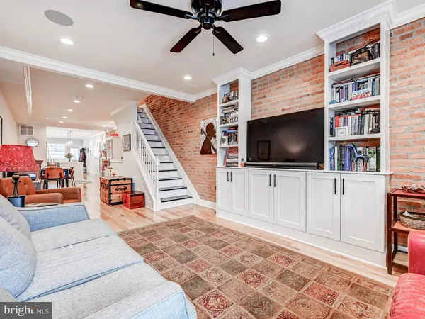 a view of a livingroom with furniture and workspace