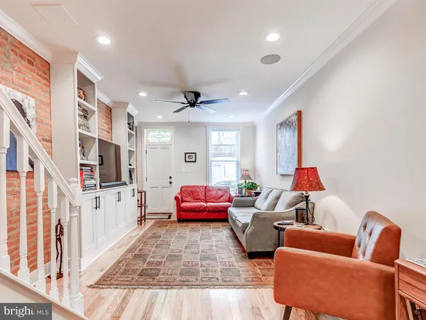 a living room with furniture or couch and a flat screen tv