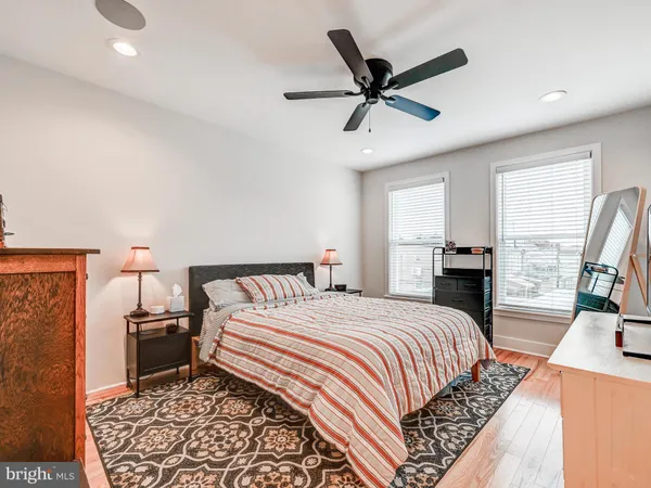 a bedroom with a bed a fireplace and a walk in closet
