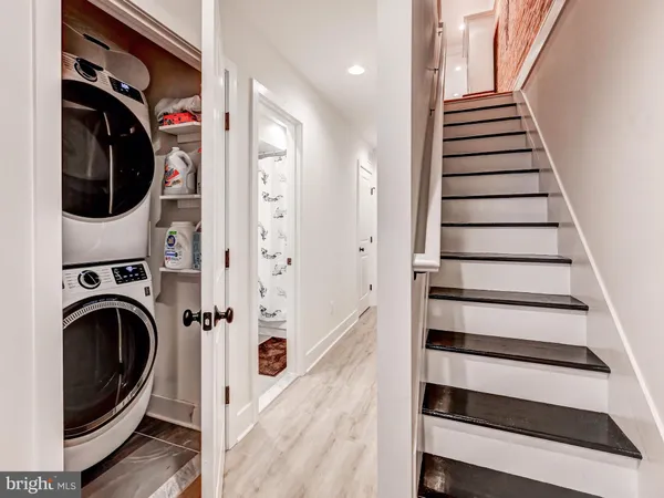 a bathroom with a double vanity sink toilet and a mirror